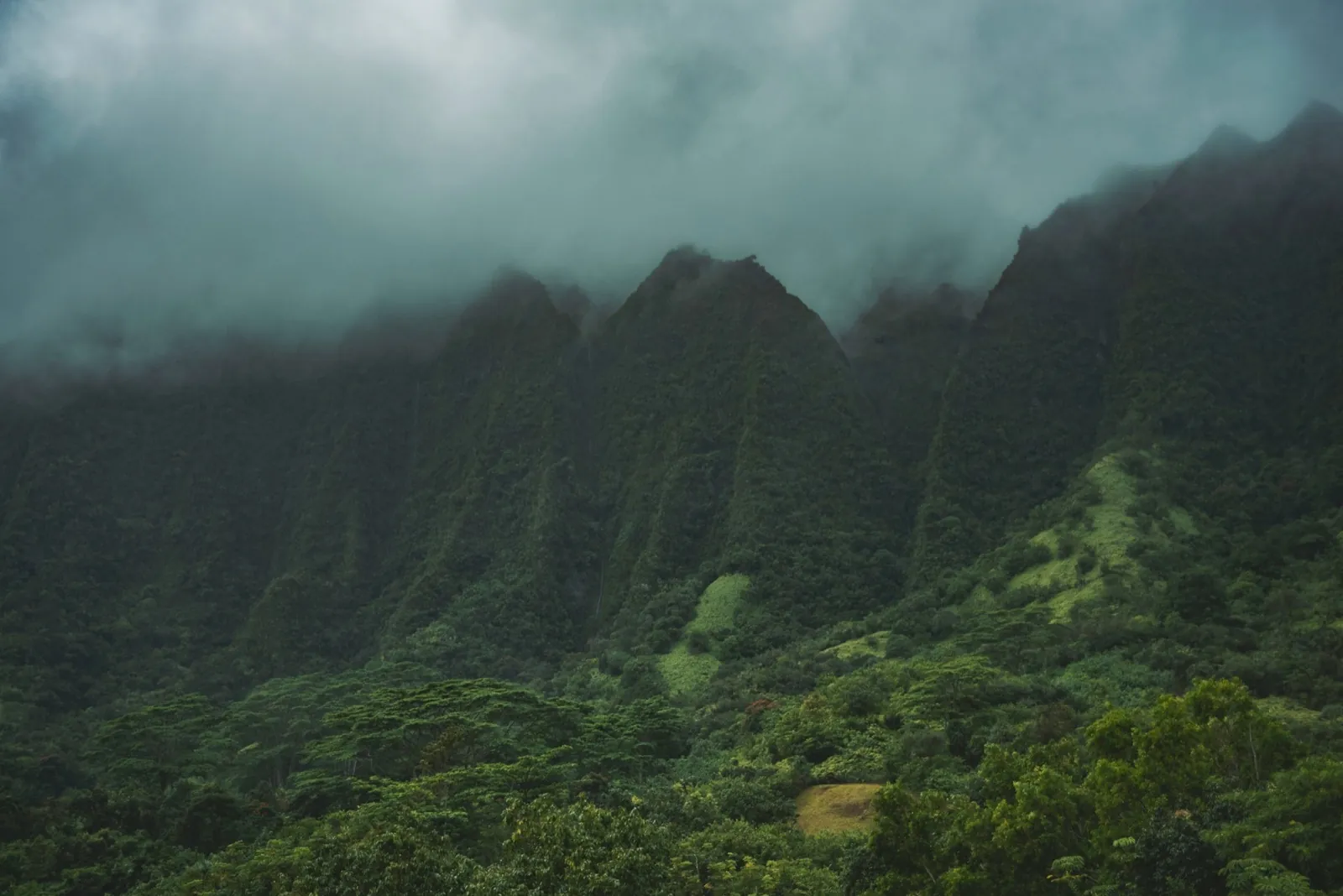 Heavy rain clouds over green Hawaiian mountains