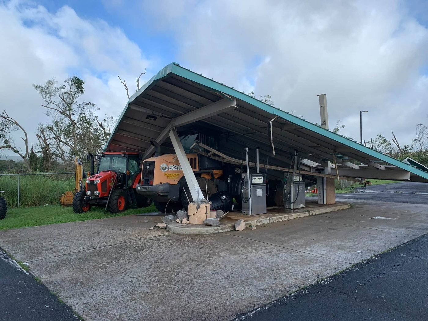 Hurricane Lowell wind damage to a gas bay structure at the state base yard on Kauaʻi