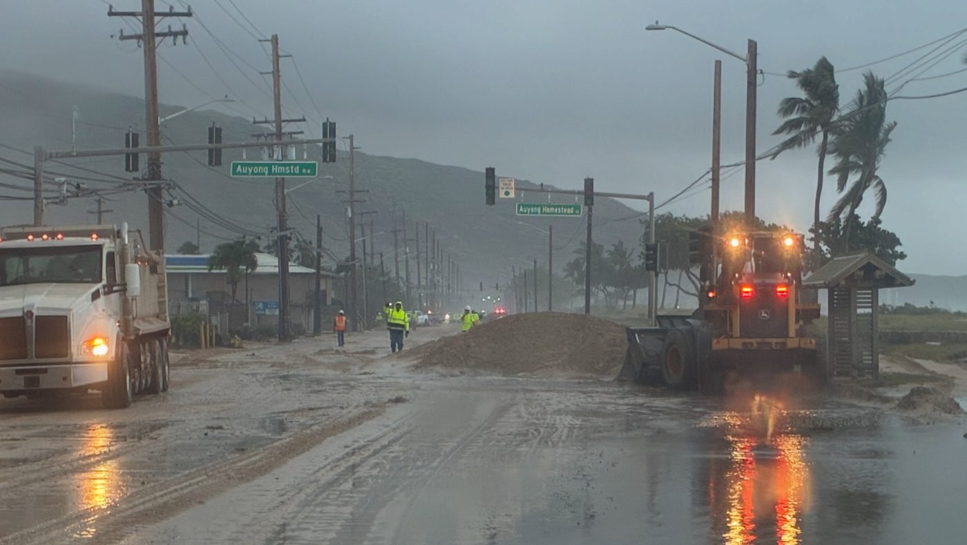 Sand from storm surge covering Farrington Highway in Nānākuli, Oʻahu after Hurricane Lowell