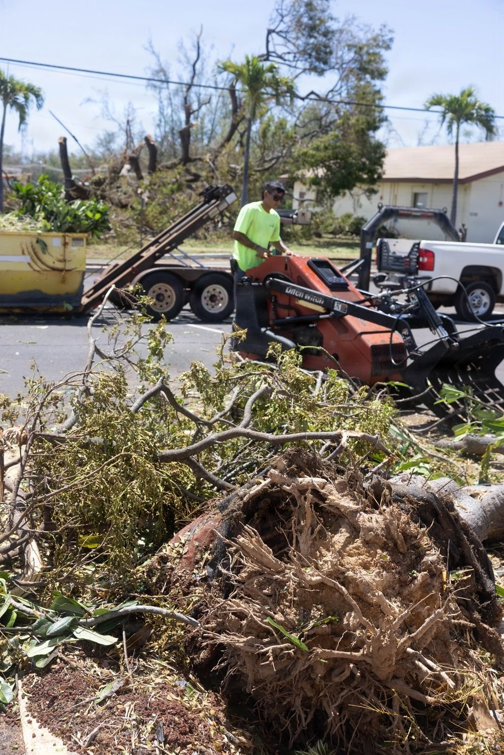 Recovery crews clearing fallen trees and storm debris at Pacific Missile Range Facility, Kekaha, Kauaʻi, after Hurricane Lowell