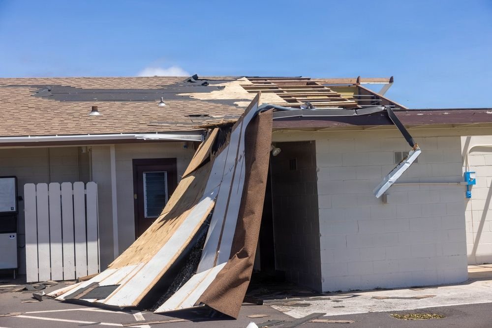 Roofing and fascia peeled off an office building at Pacific Missile Range Facility, Kekaha, Kauaʻi, after Hurricane Lowell