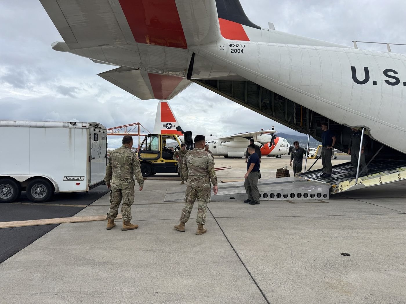 U.S. Coast Guard and Hawaii Army National Guard unloading supplies from an HC-130 at Hilo International Airport before Hurricane Nolo, September 25, 2026