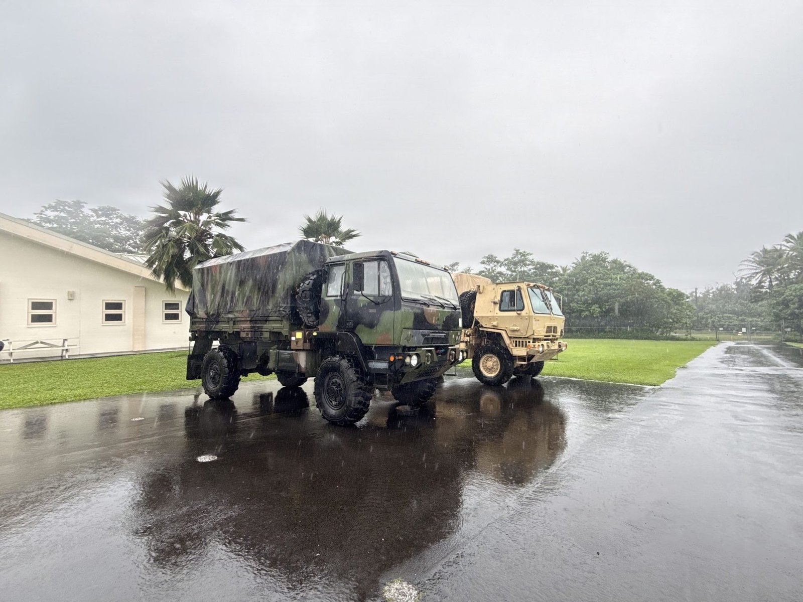 Hawaii National Guard high-water vehicles in heavy Hurricane Nolo rain at Keaukaha Military Reservation, Hilo, Hawaiʻi Island, September 27, 2026