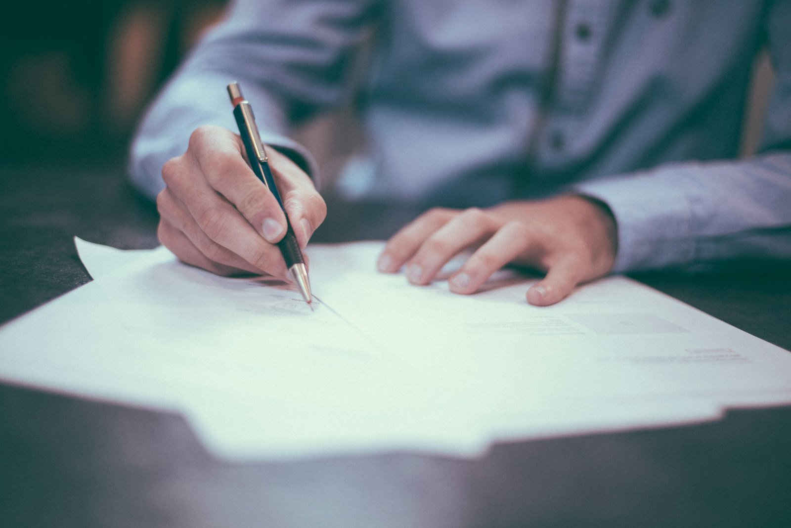 Reviewing claim paperwork with a pen