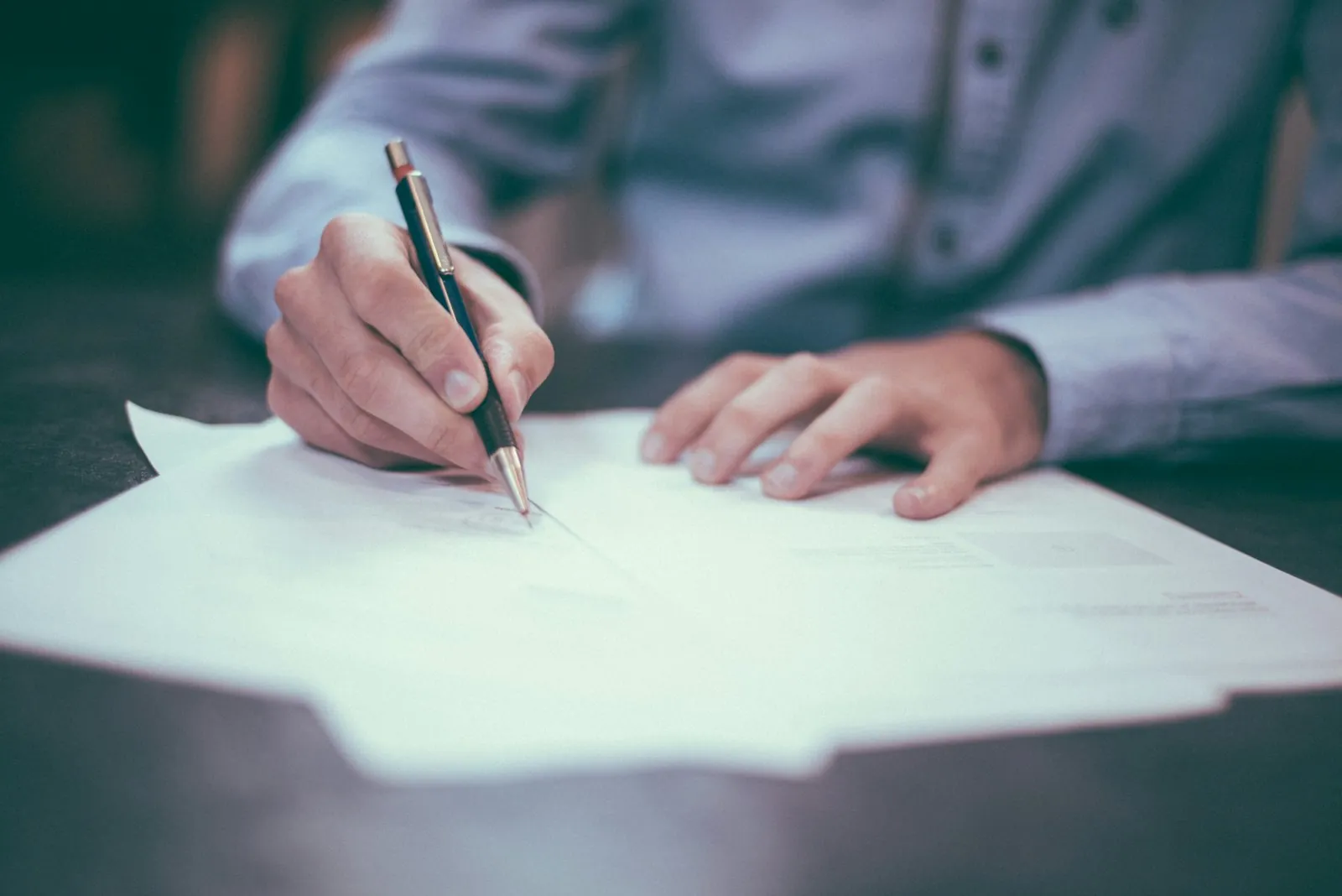 Reviewing claim paperwork with a pen