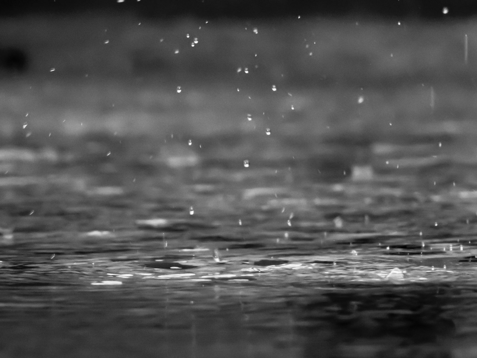 Heavy rain streaming down a window