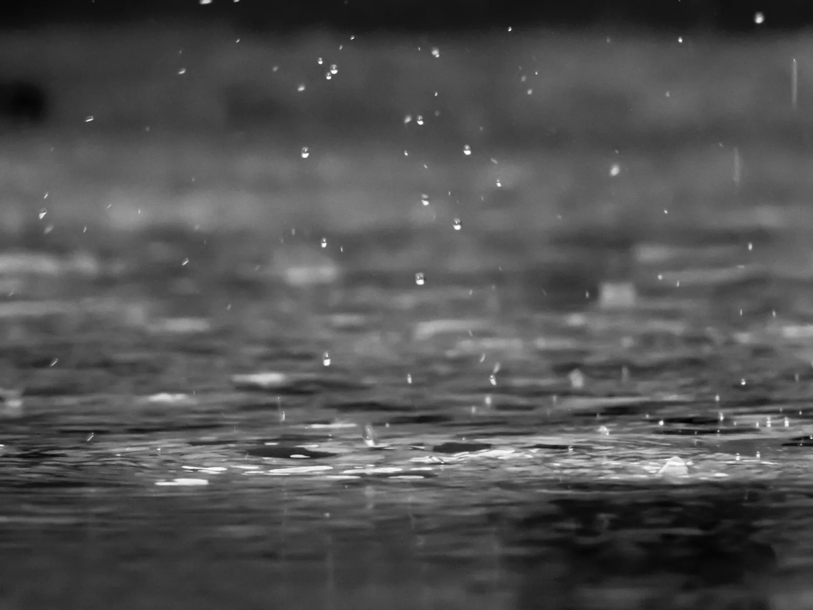 Heavy rain streaming down a window